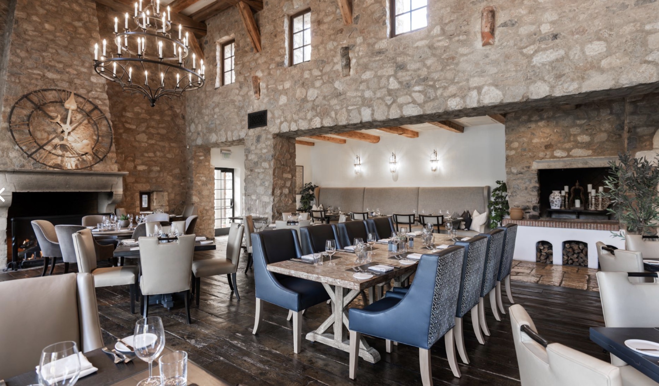 Stone-walled dining room with antique clock inside the Silverleaf clubhouse